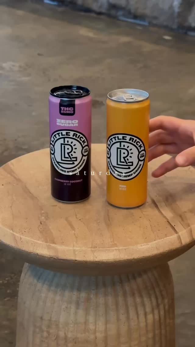 Two cans of Little Rick on a table