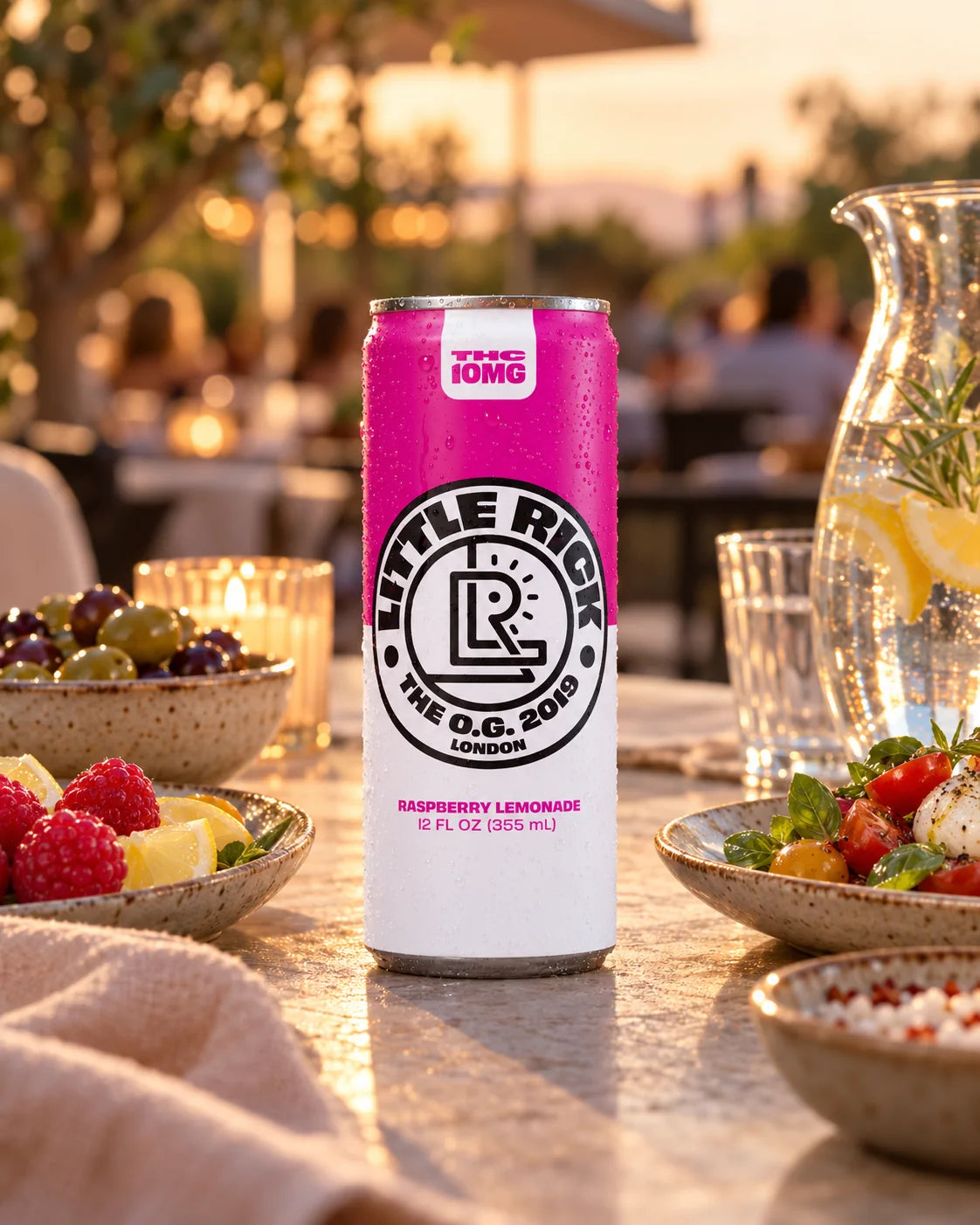 Little Rick Raspberry Lemonade 10mg THC can at an outdoor restaurant table